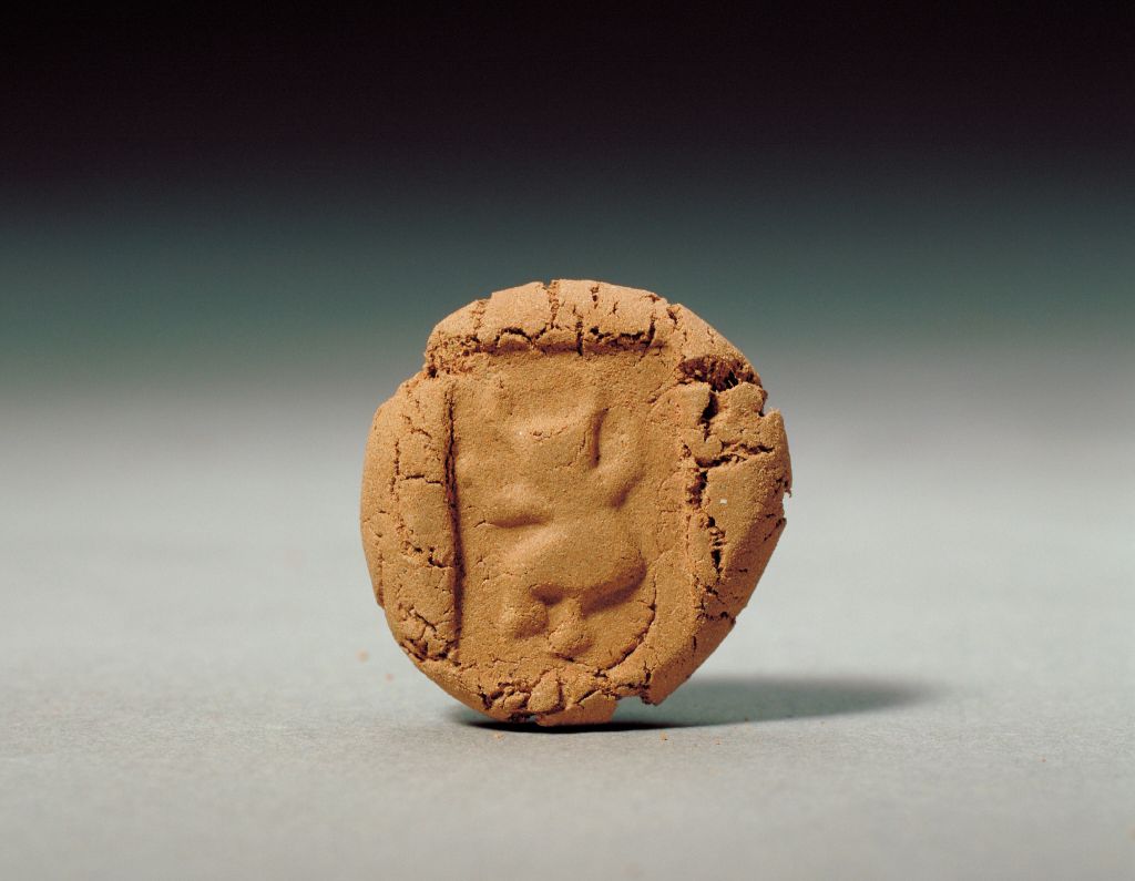 牛形象人图案铜印蜕印